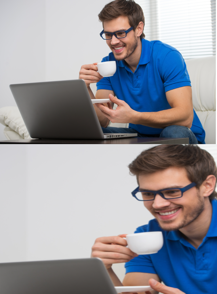 Guy drinking coffee and looking at PC with a smile