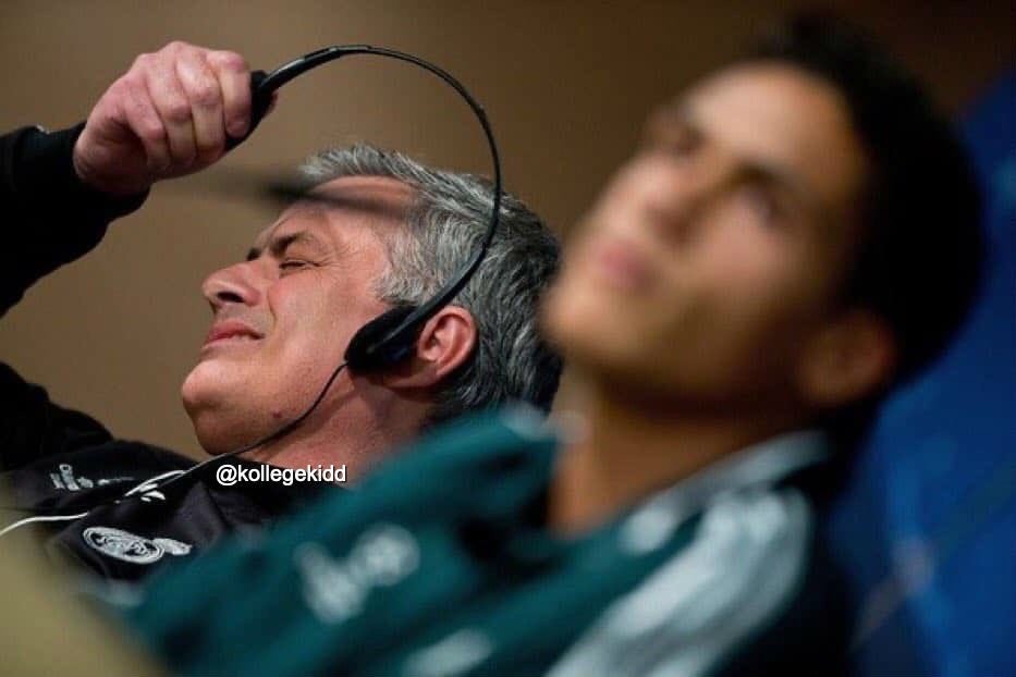 European football coach removing headphones